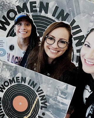 Happy persons holding up a vinyl LP