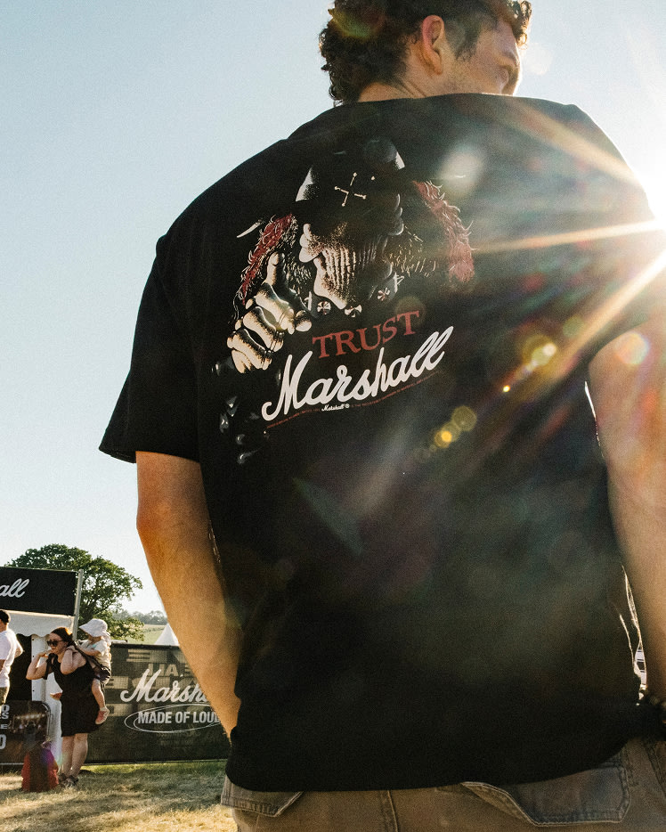 Person wearing a black Stax Reissue T-shirt, showing the big print on the back.