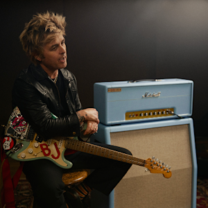 Billie Joe Armstrong sitting next to his Marshall collab amplifier