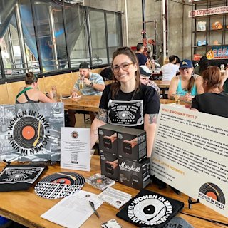 A person standing in the women’s vinyl booth