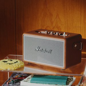 The Marshall kilburn III Brown in the corner of a living room