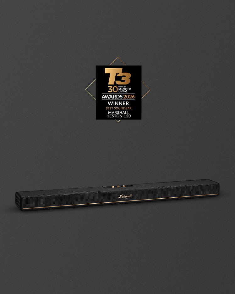 The Marshall Heston 120 soundbar, featuring a sleek black design with gold accents, stands out against a dark grey background.