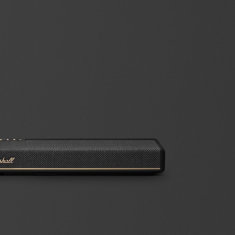 Marshall Heston 60 Black soundbar, featuring a slim black design with gold accents, stands out against a dark background.