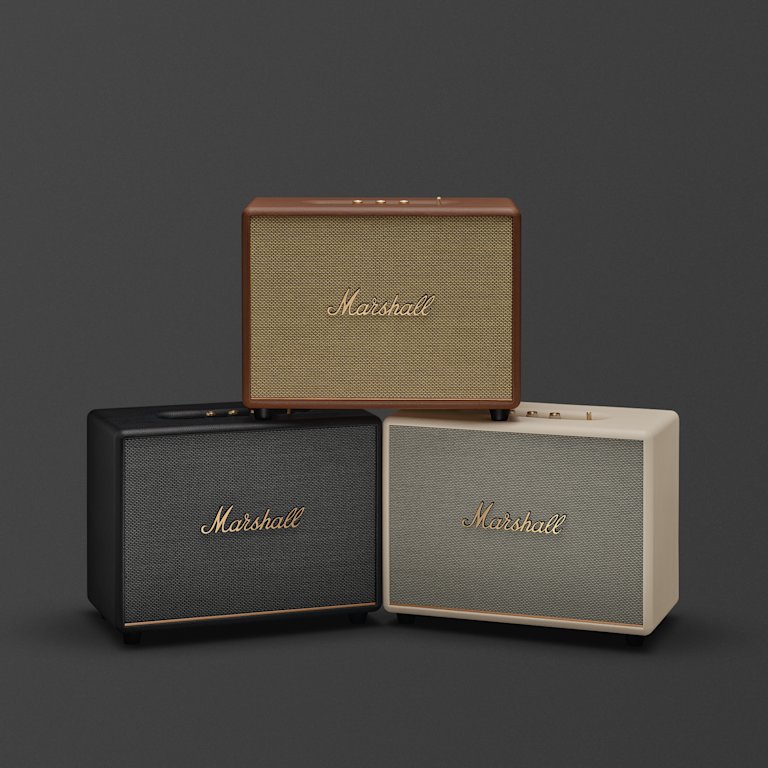 The Marshall Woburn III bluetooth speakers: a brown one on top, with black and cream beneath.