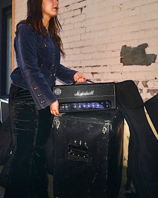 A person carrying the Hendrix amp head