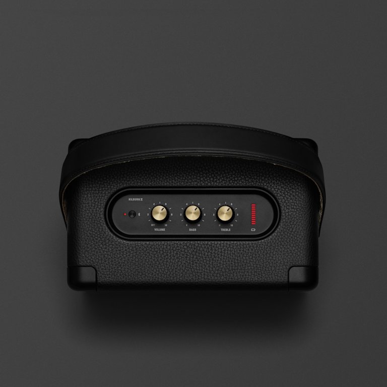 The Marshall Kilburn II Black and Brass is a portable speaker in black with a red button on it.