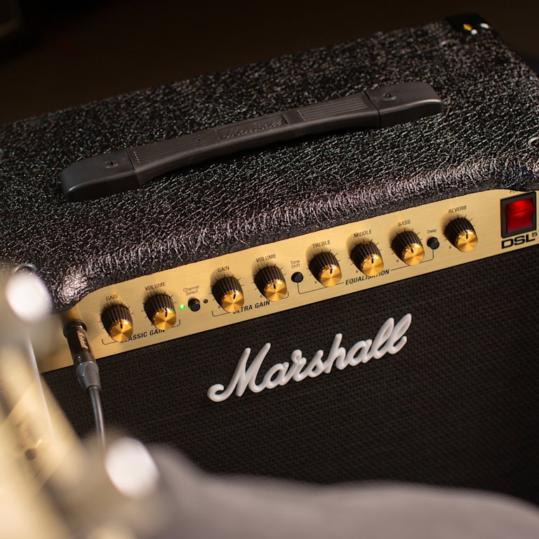 Left side top view the Marshall DSL5 Combo showing knobs and logo.