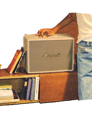A person adjusting the settings on the top panel of the Woburn III