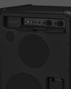 Close-up of the back panel of a Marshall Bromley 450 speaker showing input/output ports, control knobs, and speaker grille.