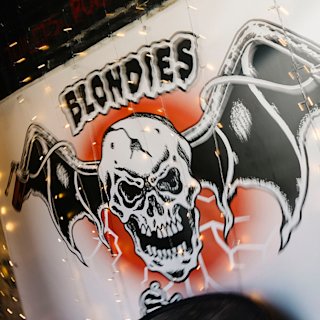 The logo of Blondies featuring a skeleton