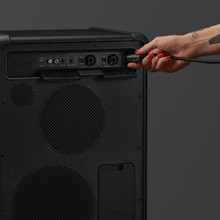 A person is inserting a plug into the Bromley 450