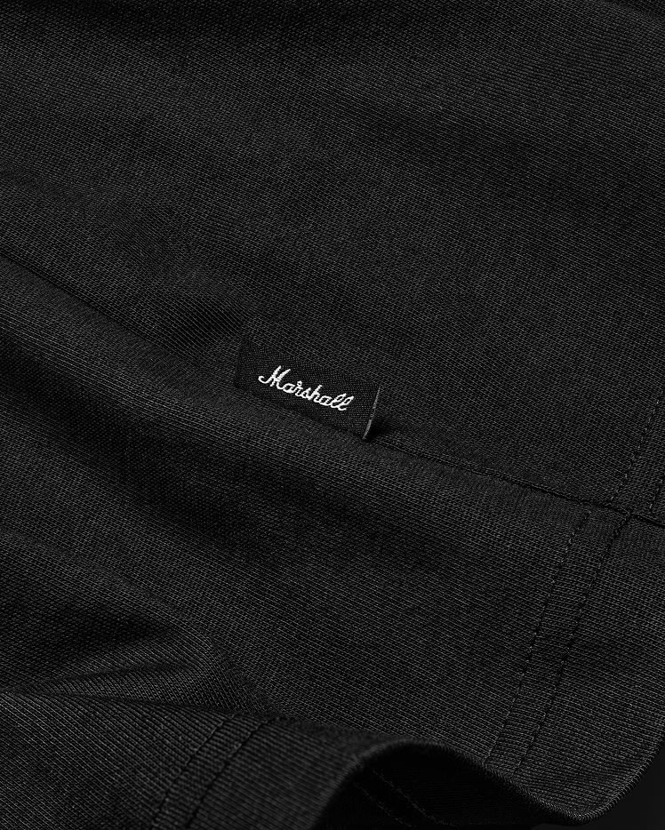 Close-up of a Stax Reissue T-shirt Black with visible stitching and a small black label that reads "Marshall" in white script.