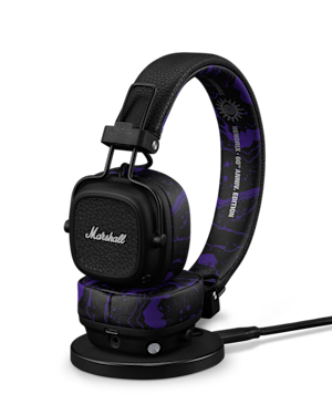 Major V Hendrix Edition headphones resting on a black charging stand.