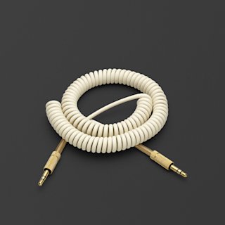 A cream Marshall SPEAKER AUDIO CABLE.