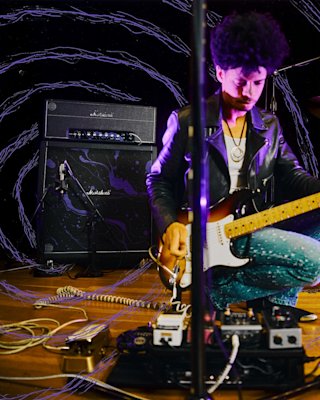 A man playing and using the Marshall X Hendrix 60th anniversary Half stack
