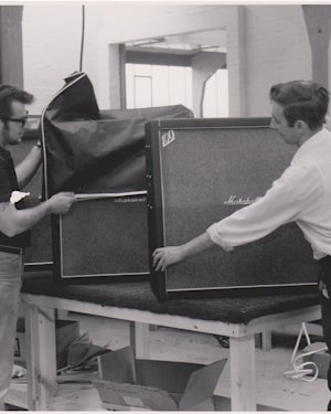 People uncovering Marshall amps