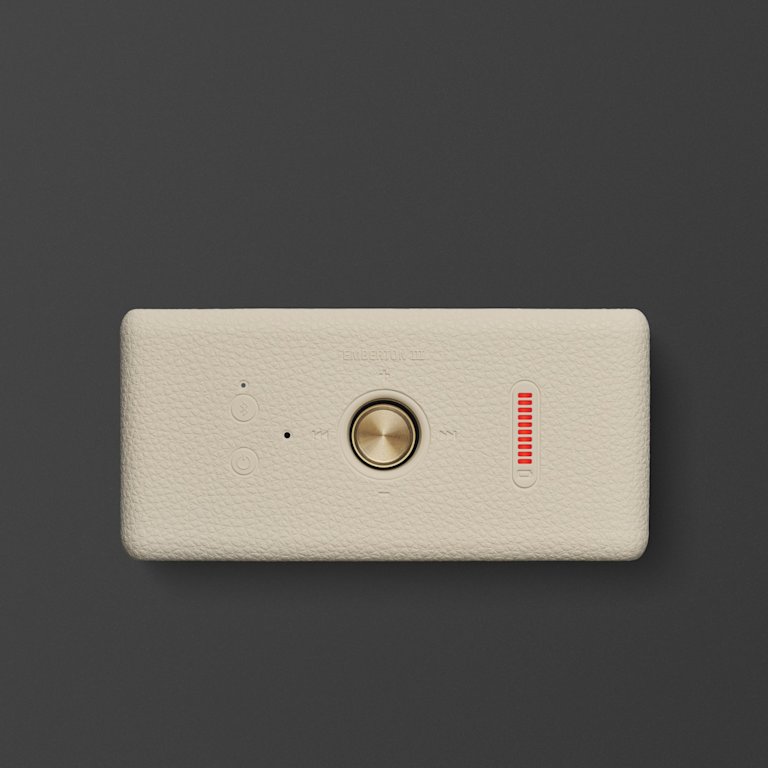 Marshall Emberton III Cream Bluetooth speaker with a gold knob and a vertical red LED indicator on a gray background.