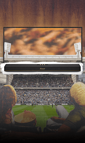 Friends watching the World cup games on their TV with sound from Heston 120 by Marshall