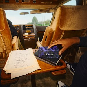 Friends in a road trip listening to music through the new Emberton III Hendrix Edition