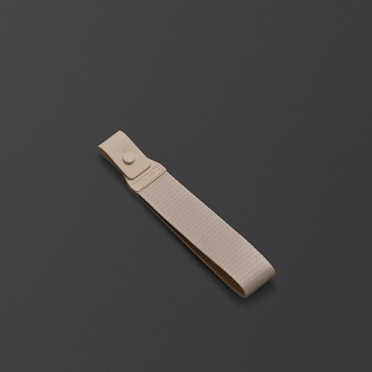 Middleton II Cream Strap against a dark background.