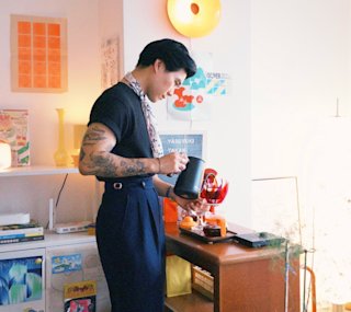 Art director Michael Lim making coffee in his studio