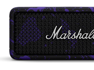 Close-up of a Marshall Emberton III Hendrix Edition speaker with a black mesh grille, purple splatter design on the frame, and the Marshall logo in silver script.