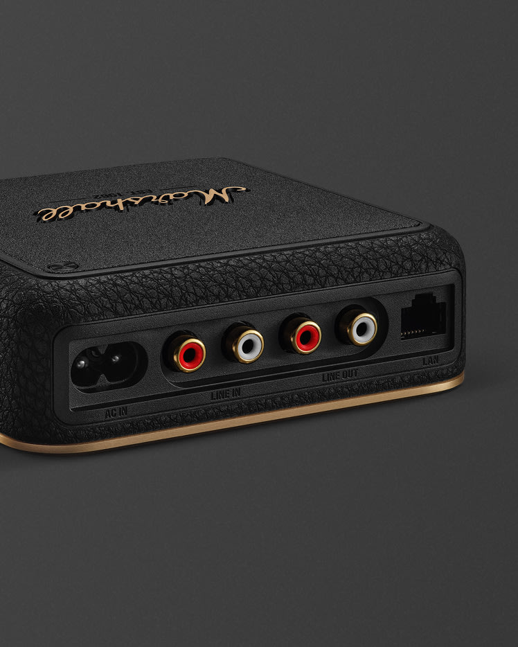 Close-up of the rear panel of a Heddon showing AC power input, line-in/out ports, and a LAN port on a dark background.