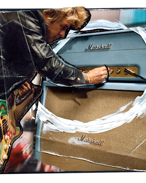 Billie Joe Armstrong in a leather jacket adjusts the knobs on a Marshall 1959 BJA Artist Signature.