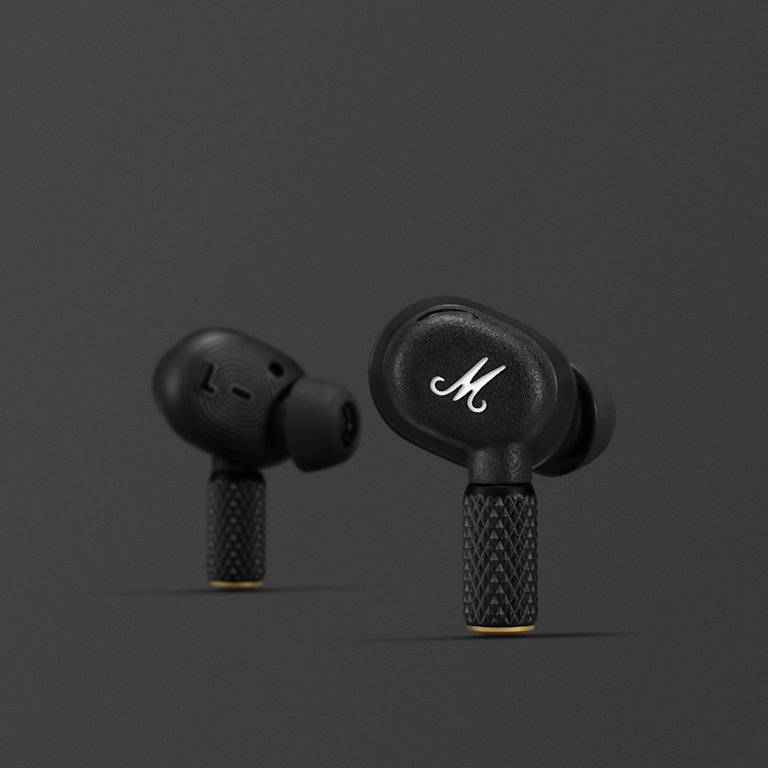A pair of MOTIF II A.N.C. BLACK earphones with the letter m on them. (Marshall)