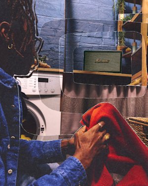 A person sits near a washing machine, folding red laundry, with Acton IV Black speaker on a shelf in the background.