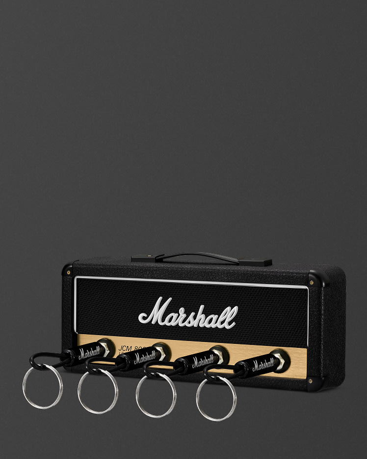 Jack Rack JCM800: Reissue key holder with four guitar plug keychains inserted into the front panel, against a plain background.
