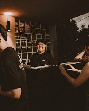 A group of people smiling and vibing