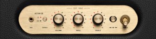 Close-up of the Acton III home speaker control panel with knobs for source, volume, and bass, and an aux input.