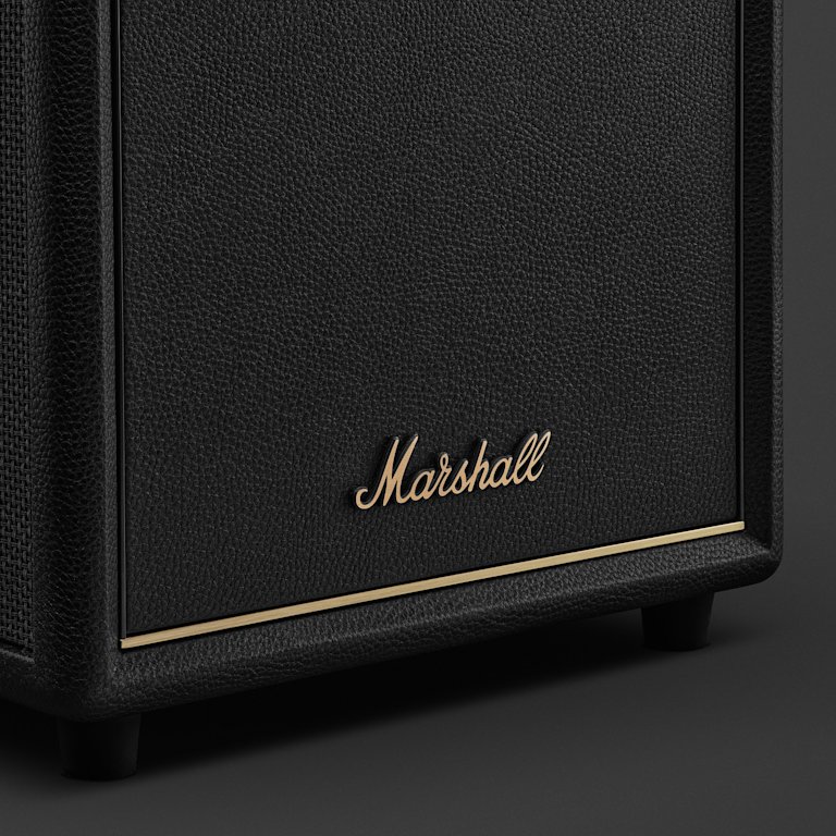 Close-up of the Marshall Heston Sub 200 Black TV subwoofer featuring a textured surface, gold trim, and the iconic Marshall logo.