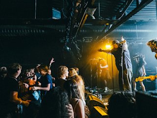 Knives performing in front of a crowd