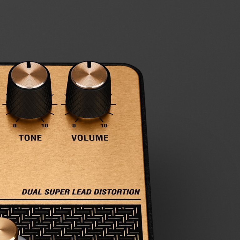 The Tone and volume knobs of the Marshall DSL Overdrive pedal.