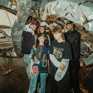 Knives posing at a clothing store.