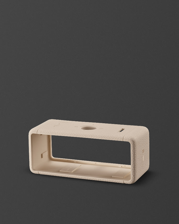 Emberton II Cream Sleeve against a dark background.