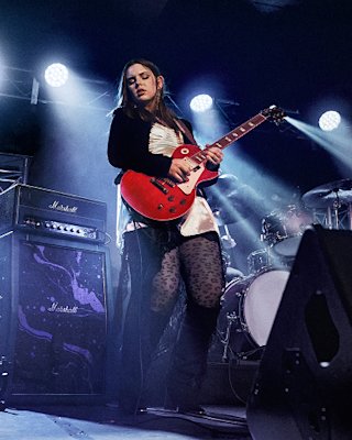 Ally Venable playing live on stage with a Hendrix amp