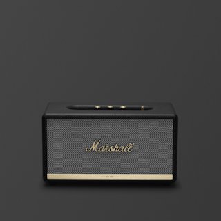 A Marshall Stanmore II Bluetooth speaker featuring a textured grille and gold accents against a dark gray background.