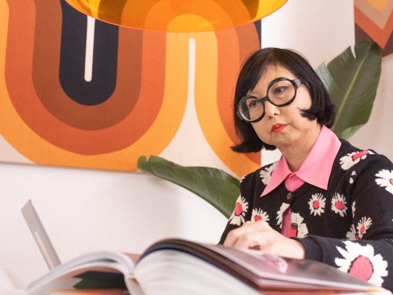 Shirley Kurata is reading a book