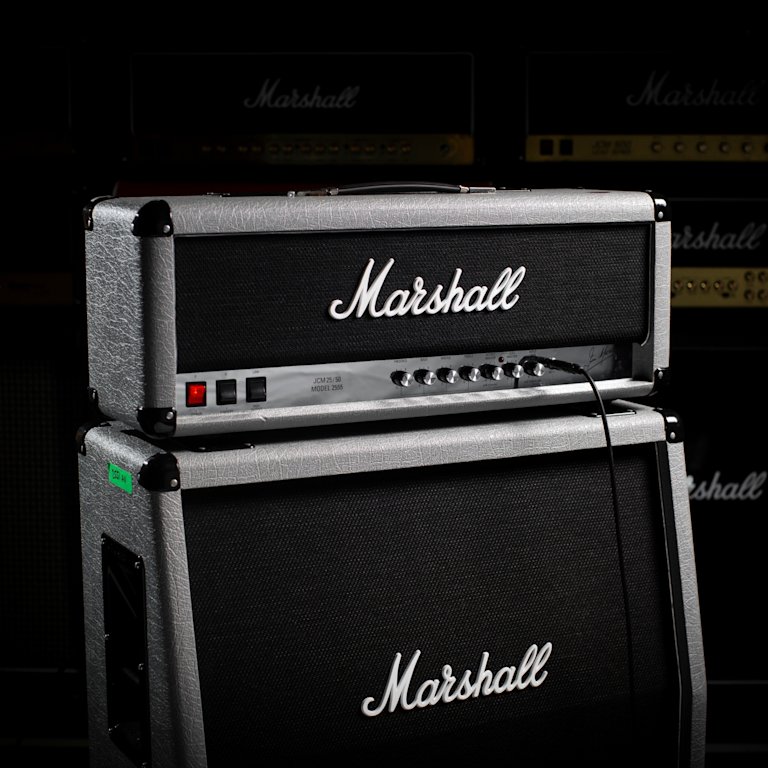 The Marshall Silver Jubilee 2555X Vintage Reissue Head on top of the angled Marshall amplifier of the same range.