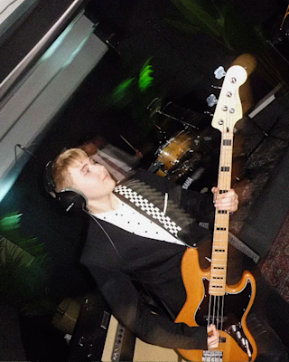 A musician is playing the electric guitar