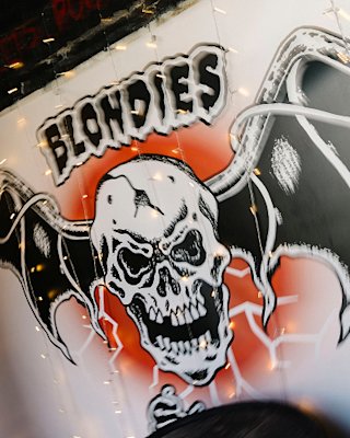 A slightly motion-blurred image featuring the Blondies logo