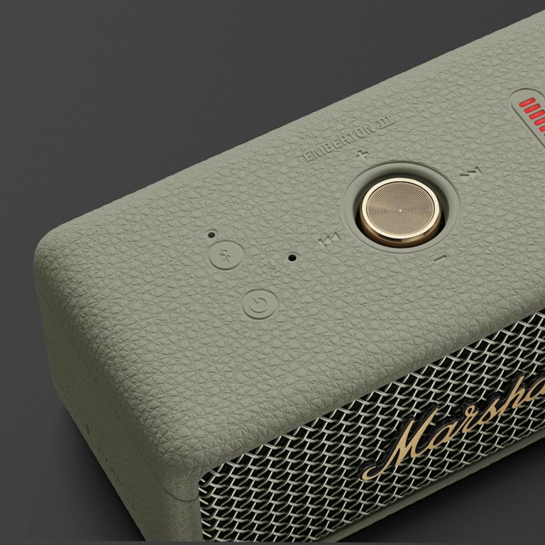 Close-up of the Marshall Emberton III Sage Bluetooth speaker, featuring a classic textured design and a gold control knob.