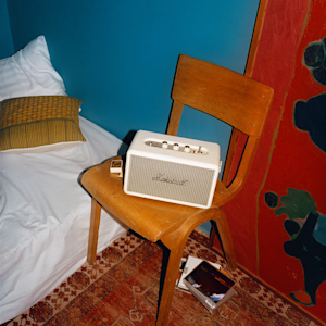 The Marshall Minor IV Cream placed on top of green tiles