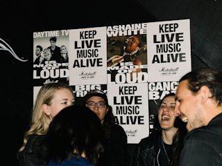 A crowd gathered around ‘Keep Live Music Alive’ posters