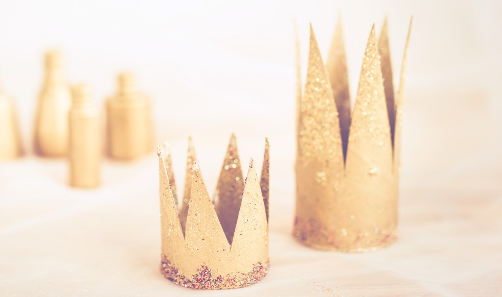 Two paper crowns made from paper towel rolls