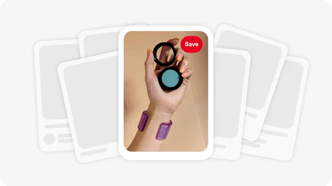 A Pin featuring a hand holding an open eyeshadow container, with a stack of black-and-white Pins behind the eyeshadow image.