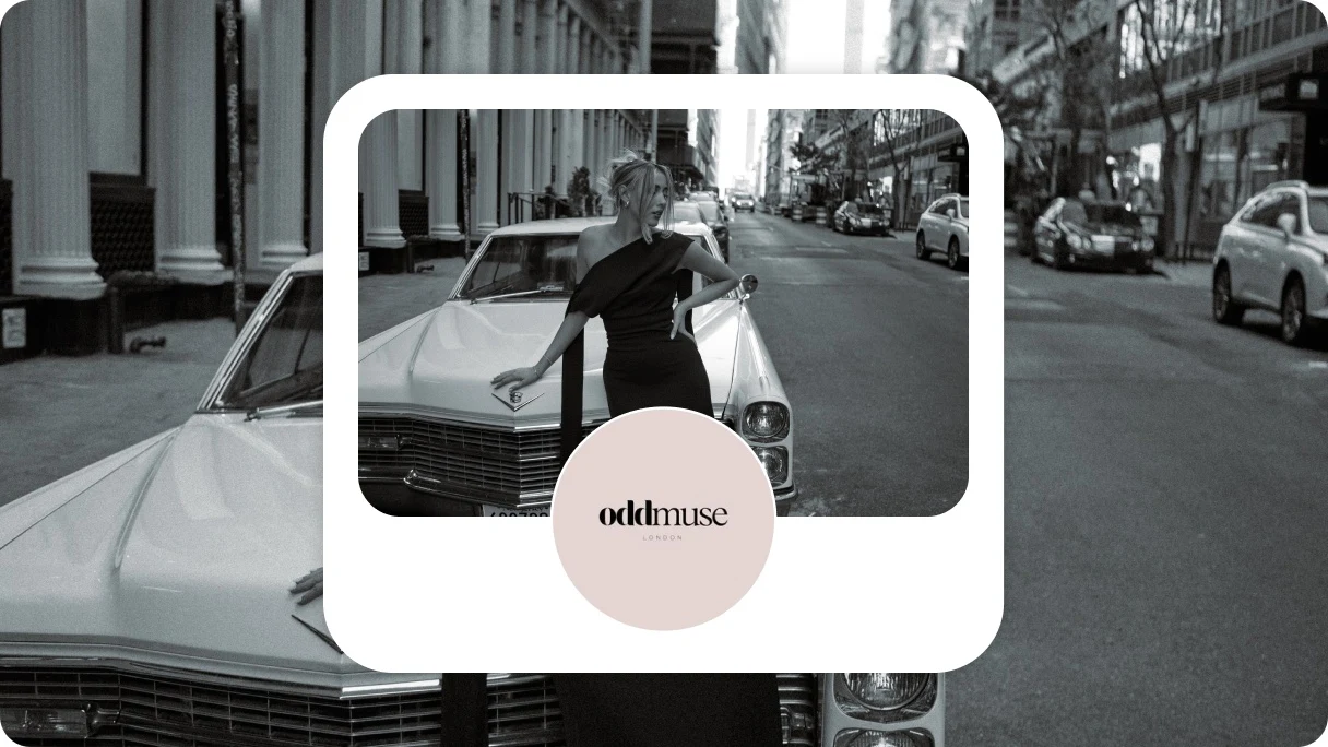 Pinterest profile card for Oddmuse. Circle with the black Oddmuse logo on a pale pink background, in front of a black and white image of a woman wearing a black dress leaning against a classic white car.